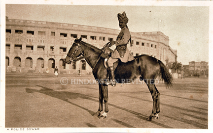 /data/Original Prints/Portraiture, Portraits, Occupations, Trades and Professions, People/A POLICE SOWAR (IN OLD BOMBAY SEEN AGAINST THE INSTITUTE OF SCIENCE).jpg